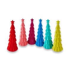 colorful plastic christmas trees lined up in a row