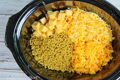 the ingredients for macaroni and cheese are in the crock pot, ready to be put into the slow cooker