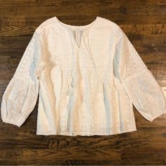 Baby Doll Style White Bohemian Blouse. Size Large. It Has Really Cute Eyelet Detail On The Sleeves And The Rest Of It Has Stitching Shaped On Flowers. Soo Cute! It’s Unbranded, Bought Online From A Boutique Recently. It’s Just Been Sitting In My Closet. Listing New With Tags But Doesn’t Actually Have Tags Attached Bc It Didn’t Come With Any. Still New In Bag, Never Worn. Peasant Long Sleeve Tops For Vacation, Feminine Puff Sleeve Tops For Beach, Cotton Blouse With Lace Trim For Brunch, Bohemian Cotton Puff Sleeve Tops, Bohemian Cotton Tops With Puff Sleeves, Bohemian Puff Sleeve Tops For Brunch, Cotton Puff Sleeve Top For Beach, Cotton Peasant Top For Brunch, Long Sleeve Tops With Lace Trim For Vacation