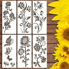 sunflower stencils are shown on a wooden table next to some yellow flowers