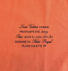 an orange t - shirt with the words louis vuitton home printed on it