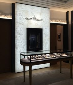 a display case in the middle of a room filled with jewelry