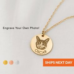 a gold plated necklace with an image of a cat on it and the words oscar written in cursive writing