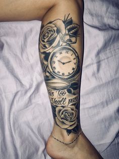 a person with a tattoo on their leg has a clock and roses tattooed on it