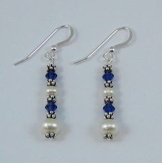 These are my signature earrings.  They are made with large and medium white pearls, Sapphire colored Swarovski  Crystals and sterling silver spacer beads.  They are designed to go with my necklace N105a. White Sterling Silver Jewelry With Spacer Beads, Elegant Dangle Earrings With Spacer Beads, Elegant Earrings With Spacer Beads For Gift, Silver Beaded Sterling Silver Pearl Earrings, Beaded Sterling Silver Pearl Earrings, Bead Embroidery Tutorial, Embroidery Tutorial, My Signature, North Hollywood