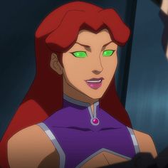 an animated image of a woman with green eyes and long red hair, looking at the camera