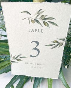 the table numbers are displayed with greenery