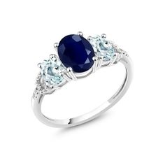 an oval blue sapphire and three stone ring