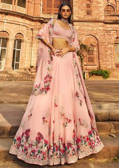 Blush pink organza lehenga set with colorful thread embroidery and embellished with pearls. Pink Floral Embroidered Semi-stitched Lehenga, Pink Organza Set With Dupatta, Pink Organza Sharara With Sheer Dupatta, Pink Resham Embroidered Organza Sharara, Pink Organza Gown With Floral Embroidery, Pink Hand Embellished Organza Lehenga, Pink Silk Anarkali Set For Reception, Pink Silk Palazzo Set With Intricate Embroidery, Pink Organza Set With Sheer Dupatta