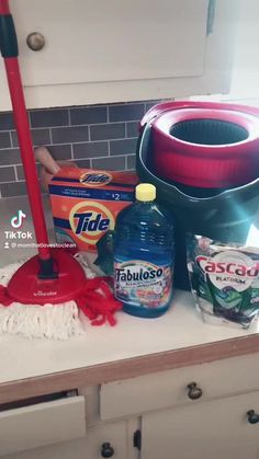 the kitchen counter is clean and ready to be used by someone with a mop