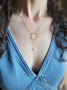 The Moon Beam Necklace features a beautiful petite Moonstone Gem. It is a lariat style necklace and is dainty and feminine! You can wear it so it is tucked into your top like shown or worn out. The circle is hammered and the length of the drop from the top of the circle down to the bottom on the chain is about 5 in. The length shown in the pictures is at a 16 in chain length. Each piece is handmade and may vary slightly as well as the stones as they are natural. Thank you! Lariat Style Necklace, The Circle, Style Necklace, Earring Necklace, Chain Lengths, Chain Length, Moonstone, The Moon, Diy Jewelry