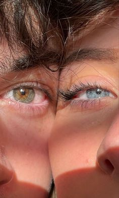 two people are looking at each other through their eyes