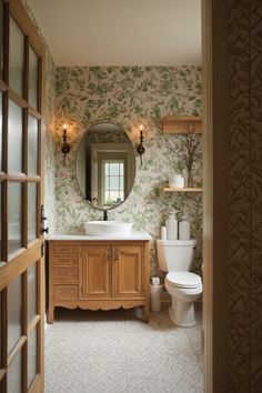 a bathroom with a toilet, sink and mirror in it's doorway way to another room