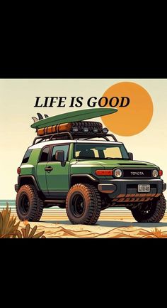 a green car with surfboards on top and the words life is good above it