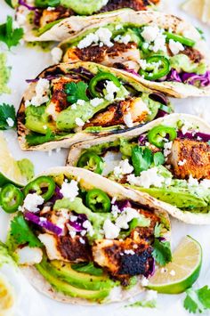 fish tacos with avocado, cilantro and feta cheese