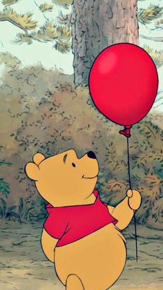 winnie the pooh holding a red balloon