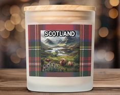 a scottish themed candle is sitting on a table