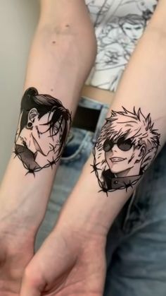 two people with tattoos on their arms, one is holding the other's hand