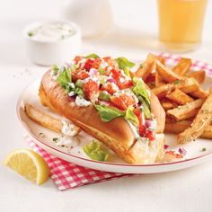 a white plate topped with a sandwich and french fries