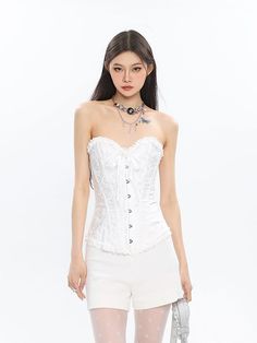 Embrace an air of sophistication with this Corset Top with Feather Detail and Tulle Peplum, a daring fusion of structure and whimsy. Crafted from a high-quality blend, this top features meticulous attention to detail, from the ornate feather accents to the voluminous tulle peplum. The conventional thickness ensures comfort without sacrificing the chic silhouette. Elevate your evening wear or make a statement at an artful social gathering by pairing this top with sleek trousers or a fitted skirt. Elegant Lace Corset, Elegant Summer Lace Corset, Formal Lace Corset, White Feminine Corset Dress With Boned Bodice, Feminine White Corset For Summer, Elegant Spring Lace Corset, White Corset For Spring Party, Elegant Summer Corset Dress For Costume Party, Feminine White Summer Corset