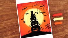 a halloween card with an image of a cat and pumpkins