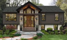 this is an artist's rendering of a house in the woods with stone and wood accents