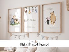 three framed pictures hanging on the wall above a bed with winnie the pooh pillows