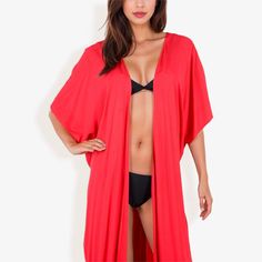 The Anna-Kaci Women's Duster Style Cover-Up with Open Front and Wide Sleeves is the perfect addition to your beach or poolside wardrobe. This flowing cover-up features an open front design that allows for easy wear and removal, while the wide sleeves add a touch of bohemian elegance. Made from lightweight, breathable fabric, it ensures comfort and coolness on hot summer days. The versatile design makes it ideal for layering over swimsuits, bikinis, or casual outfits, providing a chic and effortl Spring Solid Color Poolside Cover-up, Spring Poolside Solid Color Cover-up, Solid Color Summer Pool Cover-up, Solid Summer Pool Cover-up, Red Beachwear For Vacation, Red Beachwear Swimwear For Vacation, Summer Cover-up For Poolside, Solid Color Cover-up For Pool And Beach Season, Open Front Summer Swimwear For Pool