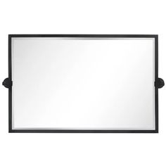 a black framed mirror on a white background with clippings to the left and right sides