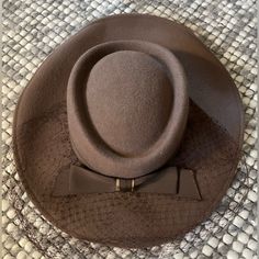 Stunning 100% Wool Hat From 1940s. Still Has The Tag On It. Features Beautiful Bow Detail And Mesh Accent. Also Has Elastic Chin Band To Hold It On. Perfect For A Tea Party Or Derby. No Size Listed Inside Space Measures 7.5” Length X 6.5” Width Fitted Retro Cream Hat, Retro Fitted Cream Hat, Retro Cream Hat, Vintage Cream Fitted Fedora, Vintage Fitted Cream Fedora, Fitted Vintage Cream Fedora, Fitted Cream Vintage Fedora, Vintage Beige Fedora Felt Hat, Retro Beige Short Brim Hat