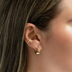 These statement small hoops feature a unique teardrop silhouette, adding a feminine twist to a bold look. Elevate your style and make a statement with these luxurious gold vermeil hoop earrings.Gold Vermeil| Lead and Nickel free.Sold as a PAIR Gold Vermeil (Thick layer of Gold plated over Sterling Silver) Width 8mm(0.3in) Inside Diameter 13mm(0.5in) Hinge closure #E190-13G Minimalist Teardrop Gold Plated Hoop Earrings, Gold Plated Huggie Ear Cuff, Gold Teardrop Hoop Earrings Minimalist Style, Minimalist Gold Teardrop Hoop Earrings, Teardrop Ear Cuff For Pierced Ears, Tarnish Resistant Huggie Ear Cuff, Chic Gold Ear Cuff For Everyday, Gold Plated Gold Teardrop Hoop Earrings, Gold Clip-on Wrap Earrings