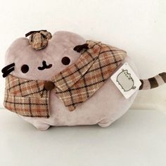 a stuffed animal with a scarf around it's neck