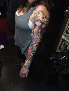 a woman with a tattoo on her arm