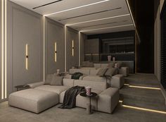 a living room filled with lots of couches next to a wall mounted movie projector