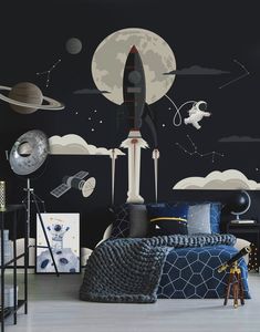 a bedroom with space themed wallpaper and black walls, including a rocket ship in the sky