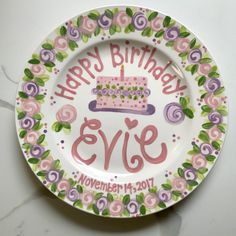 a plate with a cake on it that says happy birthday eve