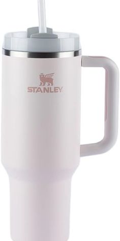 a white travel mug with a straw sticking out of the lid and handle, on a white background