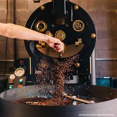 a person pouring coffee into a large pot