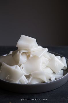 a bowl filled with white food on top of a table