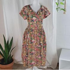 beautiful vintage floral print cotton summer dress by ERIKA 100% cotton button front top to bottom gathered seam waistline creates a full skirt with self tie wrap belt cap sleeve midi length above ankle pockets top button missing is hardly noticeable or even an issue, but perhaps you have a close match at home?? size S see pics for measurements, could possibly fit up to size M Chintz Print, Floral Chintz, Cotton Summer Dress, Grand Haven, Wrap Belt, Tie Wrap, Cotton Dress Summer, Button Front Top, Vintage Floral Print