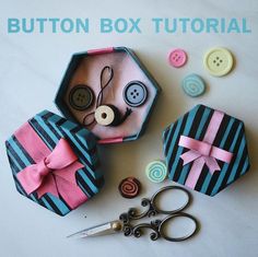 sewing supplies are sitting on a table with buttons