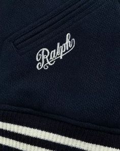 Made from wool and polyester. Ribbed trim. Fully lined. Striped, ribbed hem. Striped, ribbed baseball collar. Snapped placket. Long sleeves with striped, ribbed cuffs. Two front waist angled pockets. Interior left chest pocket. Chenille Yankees logo patch at the left chest. Ralph script embroidered at the right pocket. Felt Ralph Luaren appliqué and chenille Yankees logo patch at the center back. Classic Navy Varsity Jacket For College, Classic Navy Varsity Jacket For Fall, Cotton Varsity Jacket With Ribbed Collar, Classic Cotton Varsity Jacket With Ribbed Cuffs, Collegiate Navy Varsity Jacket With Ribbed Cuffs, Navy Varsity Jacket With Ribbed Cuffs For Fall, Varsity Outerwear With Ribbed Crew Neck, Varsity Outerwear With Ribbed Crew Neck Collar, Classic Varsity Jacket With Ribbed Cuffs And Baseball Collar