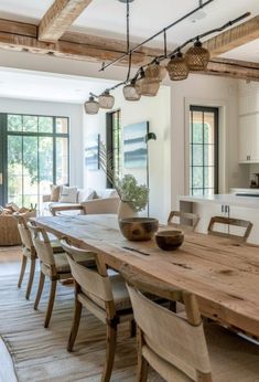 a large wooden table sitting in the middle of a living room