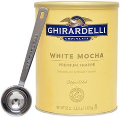 a can of white mocha next to a spoon