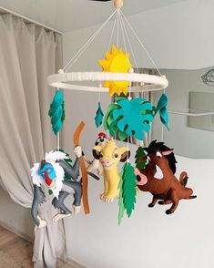 a mobile with animals hanging from it's sides