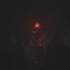 a skull in the dark with red light coming from its eyes