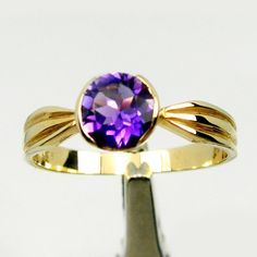 OUR JEWELLERY ARE PROUDLY 100% MADE IN AUSTRALIA BY AMBER-JEWELS (PERTH, WESTERN AUSTRALIA) This item is MADE TO ORDER Expect approx. 2-3 weeks delivery time from payment received. Item Descriptions: Beautiful 1.00 carats 1st Grade Bright Deep Purple Colour Natural Amethyst Gemstone Solitaire Ring Set In Solid Genuine 9ct Yellow Gold. Gemstone Size Is Round Brilliant Cut Approx 6.50 mm In Bezel Setting Design. Ring Specifications: Dimensions: Top View - Approx 6.95 mm wide. Bottom Shank - Approx Classic 14k Gold Amethyst Ring With Round Cut, Classic Amethyst Ring With Round Band, Classic Round Amethyst Birthstone Ring, Classic Amethyst Ring For Anniversary, 14k Gold Brilliant Cut Amethyst Ring For Anniversary, Classic Brilliant Cut Round Amethyst Ring, Classic Round Solitaire Amethyst Ring, Brilliant Cut Classic Amethyst Ring, 14k Gold Amethyst Ring For Anniversary