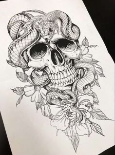 a drawing of a skull with snakes on it's head and flowers around its neck