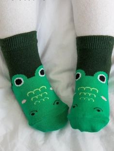 Make a splash with these snappy crocodile zoo socks, perfect for the little ones! With a playful and unique design, these socks bring a fun vibe to any outfit. Don't miss out on these jaw-some socks! 75% Cotton 23% Polyester 2% Spandex Sizes XS (0-18M), S (18M-3T) Anti-Slip Bottom Non-slip Cotton Socks For Playtime, Playful Non-slip Cotton Socks, Cute Winter Non-slip Socks, Fun Green Cotton Socks, Cute Cotton Socks For Playtime, Green Novelty Socks For Winter, Green Casual Socks For Playtime, Casual Green Socks For Playtime, Cotton Socks For Winter Playtime