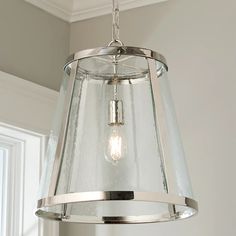 a light fixture hanging from the ceiling in a room